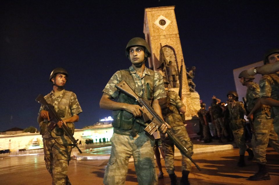 Turkish soldiers stand guard at the Taksim Square in Istanbul, Turkey