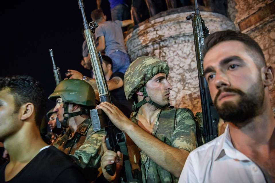 Soldiers have been giving up their weapons with the President threatening those involved in the coup would be punished
