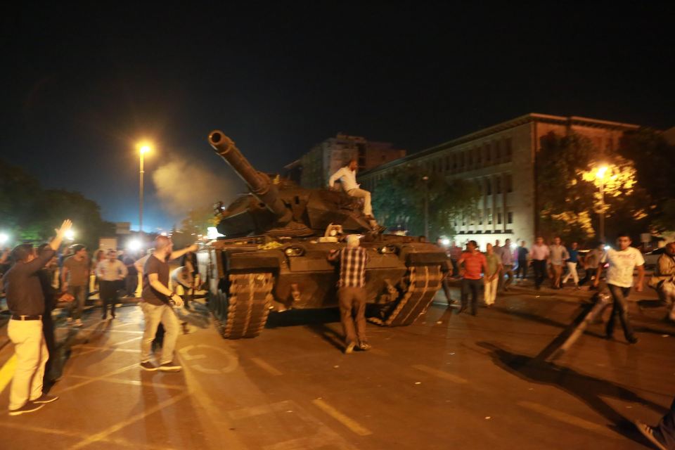 People climbed onto the military's tanks in an effort to stop the coup