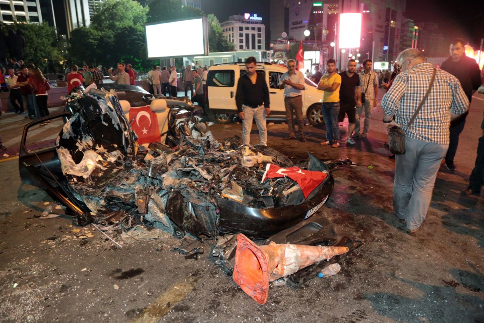 Cars were crushed by military tanks during the first night of the coup with hundreds injured