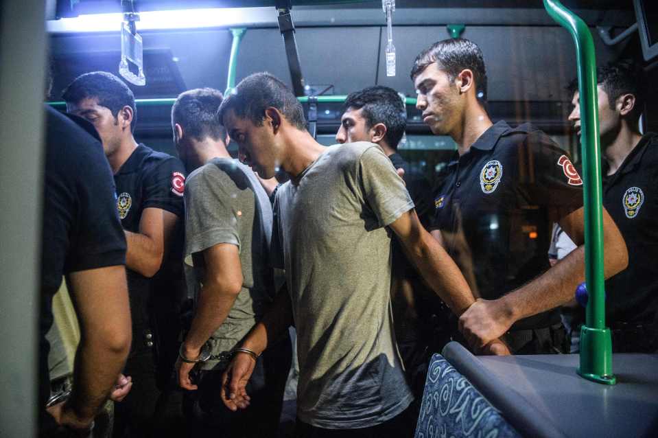 Turkish anti riot police officers detain