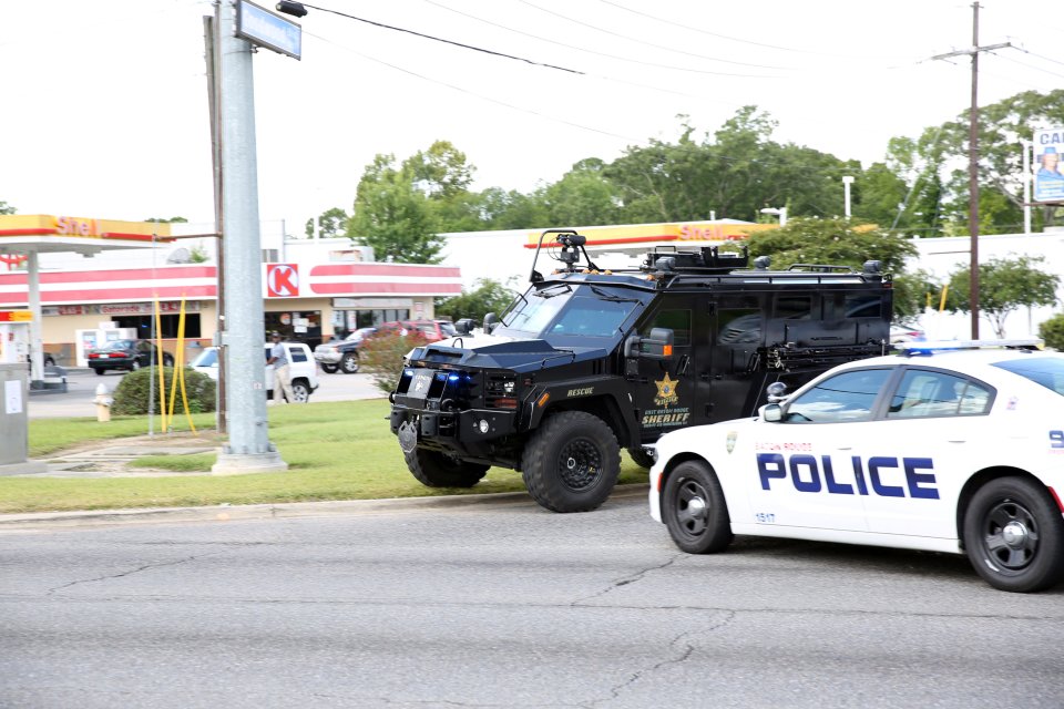  Police officers block off a road after a shooting of police in Baton Rouge