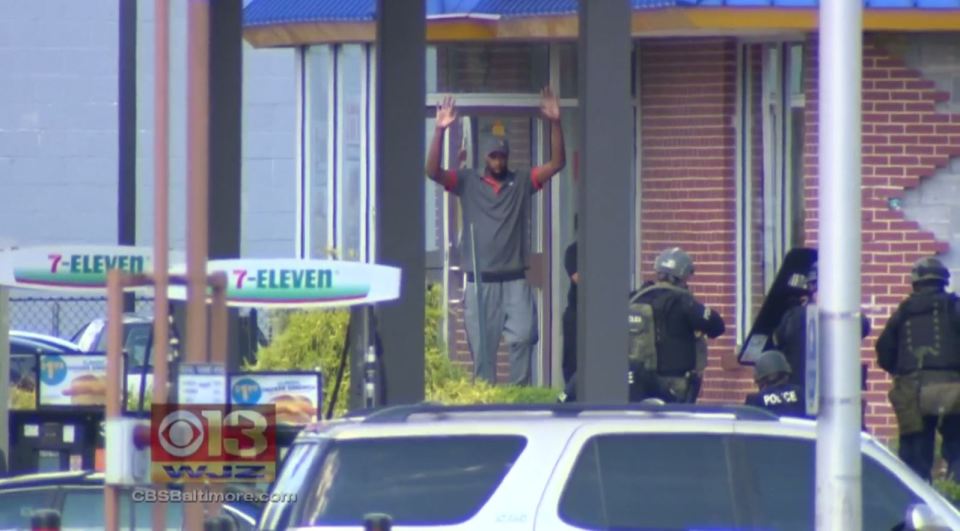The suspect eventually surrendered to police and held his hands up as he left the Burger King restaurant