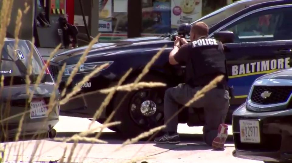 Police surrounded the Burger King after a rape suspect took four people hostage in Baltimore, Maryland