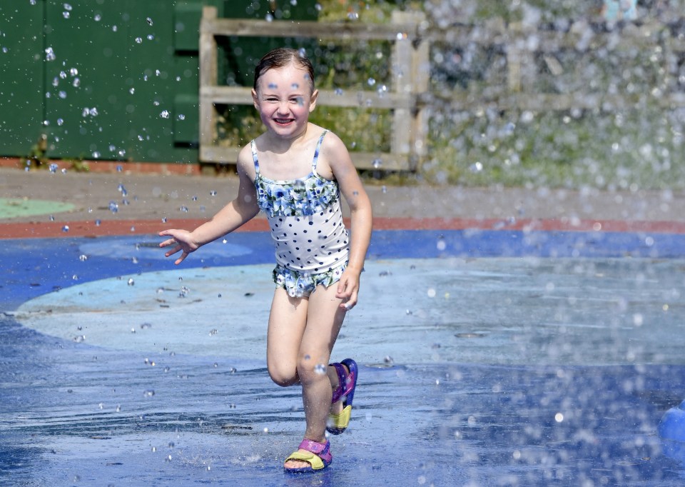 Hallie Hicks, aged 4, cools off in the water park at Southsea beach