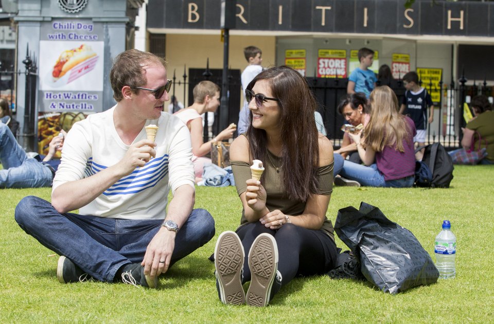 And in Edinburgh a couple enjoy ice creams in the hot sunny weather