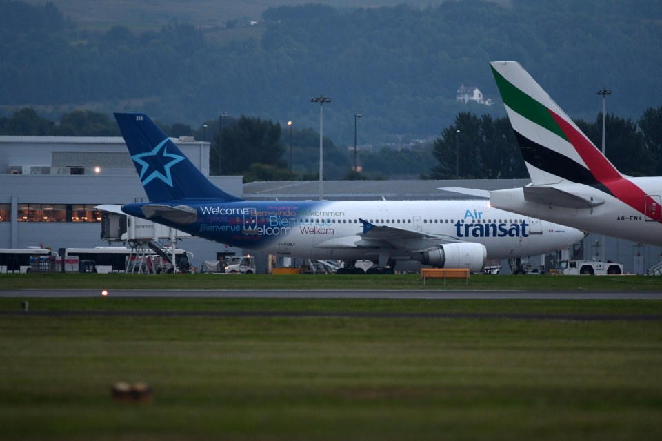 Air Transat plane/jet sat at Glasgow Airport.