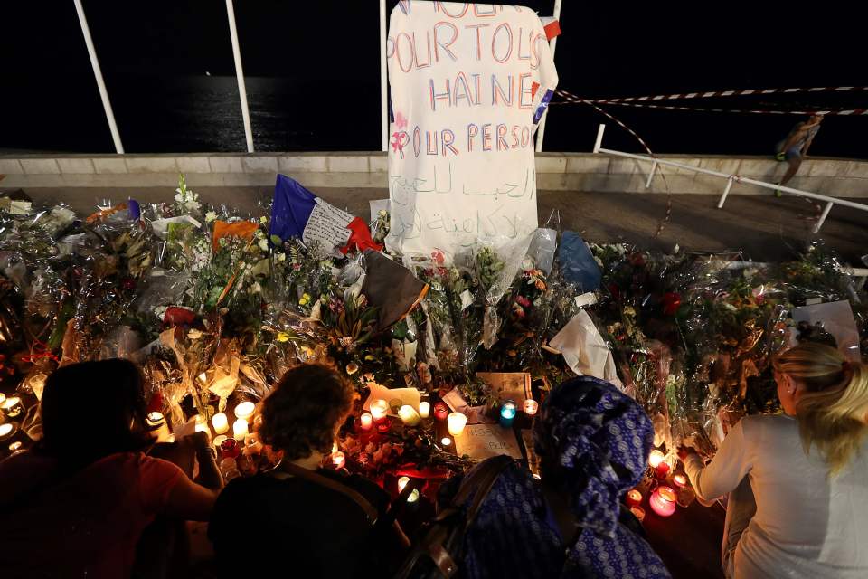 People lay flowers on the seafront in the aftermath of last weeks savage attack