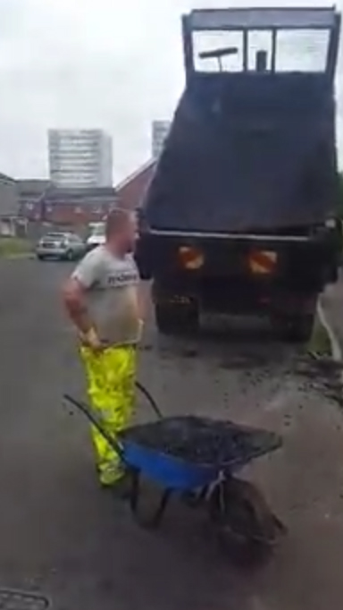 A fed-up worker looks on in disbelief at the situation unfolding before him