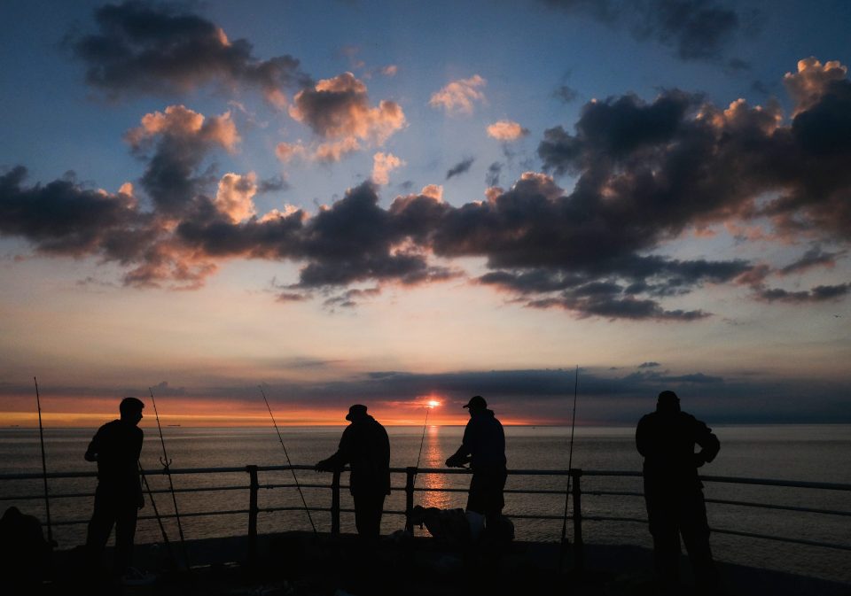 While others admired the sunrise as they caught fish in Saltburn