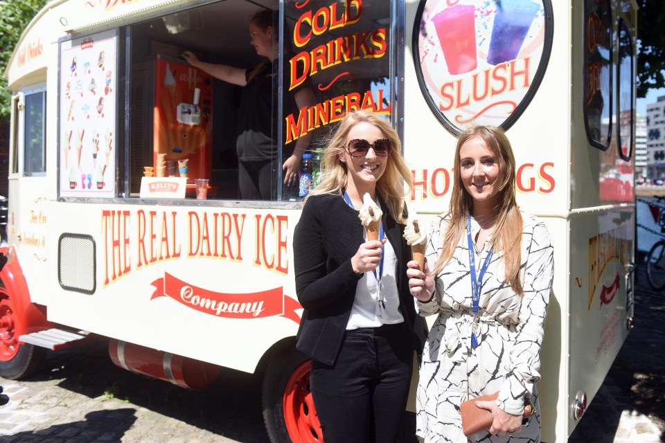 In Albert Dock, Liverpool, workers grabbed an ice cream to cool off from the intense summer heat