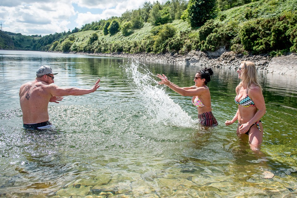 Temperatures even soared in Edinburgh where Leo Vanz, 30, Amy Johnson, 27, and Jodie Chiappa, 25, cooled down in the Torduff Reservoir