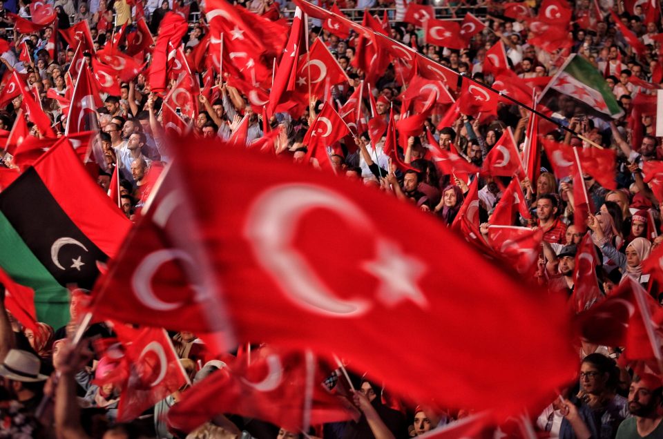 Supporters of Turkish President Erdogan lit flares and waved Turkish flags on July 19