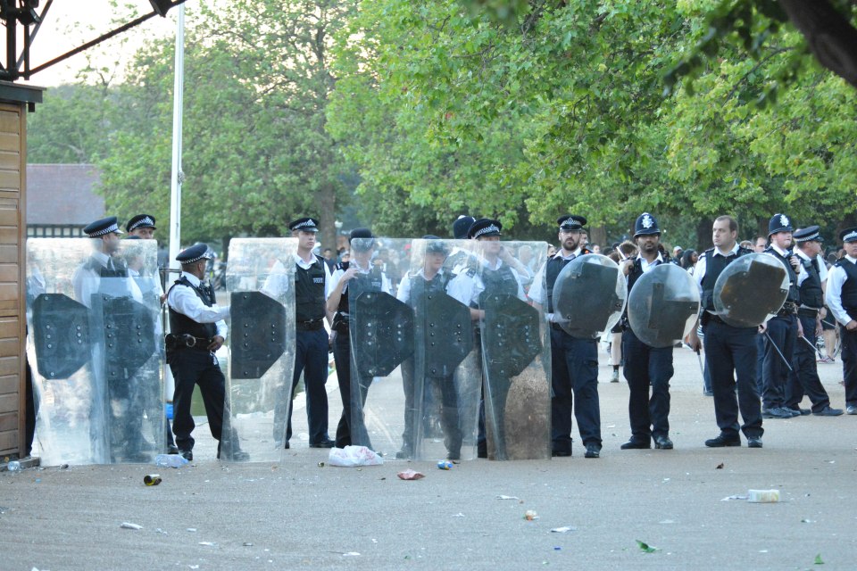 EXCLUSIVE ALL ROUNDER Two police officers have been rushed to hospital after a water fight in London's Hyde Park descended in to violence today.