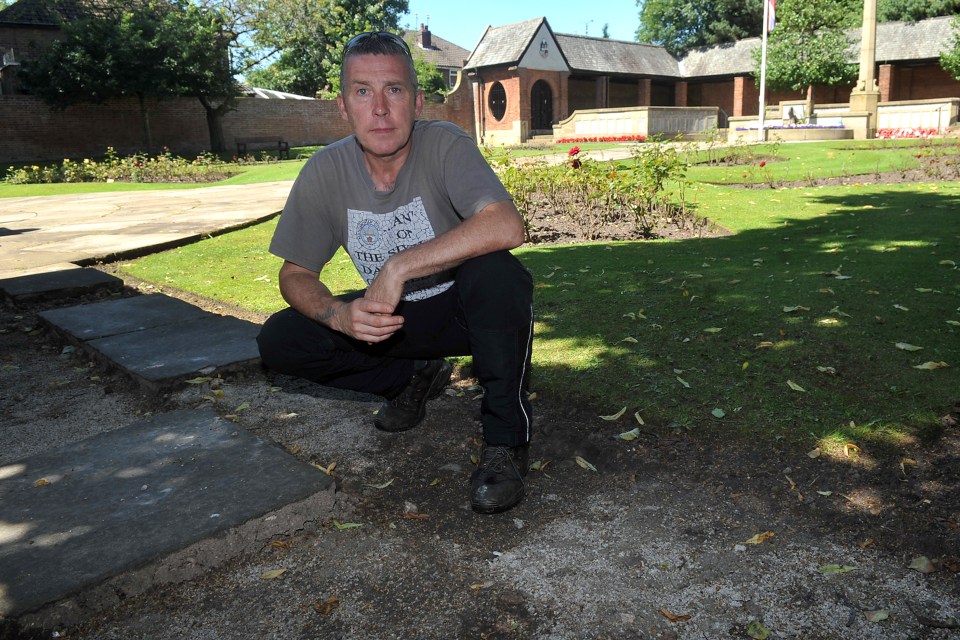 Council gardener Steven Marrow stands where the large paving slabs once sat