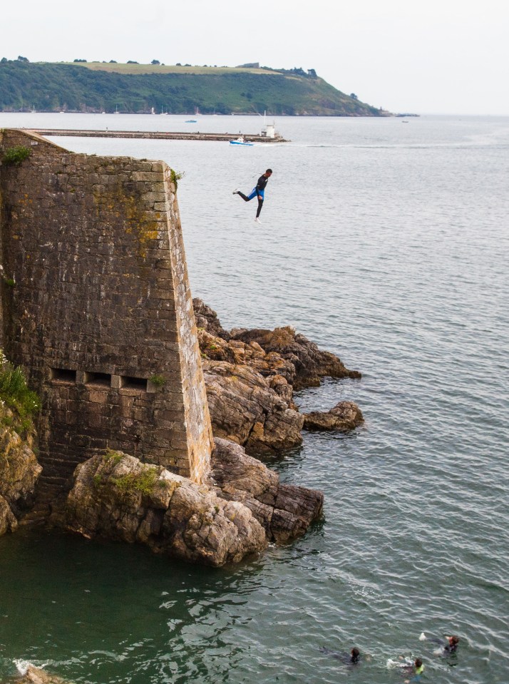 He is then seen plummeting 65ft to the water below