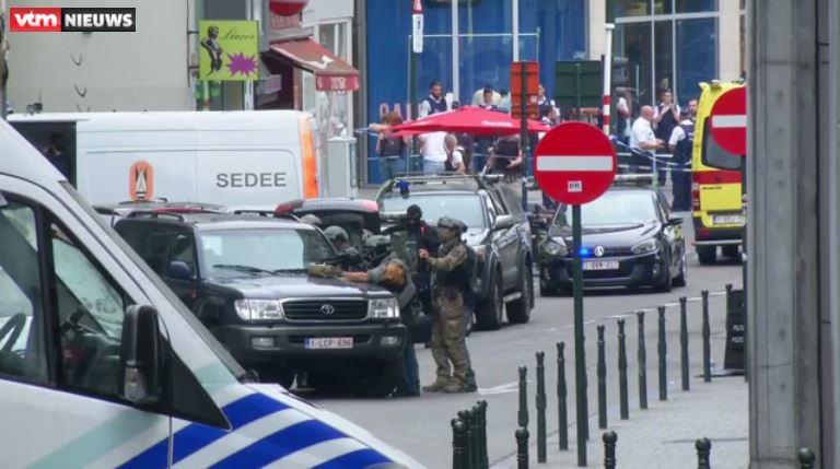 Heavilty armed security forces train their rifles on the suspect as they respond to reports of a "suspicious" man in a long winter coat with protruding wires