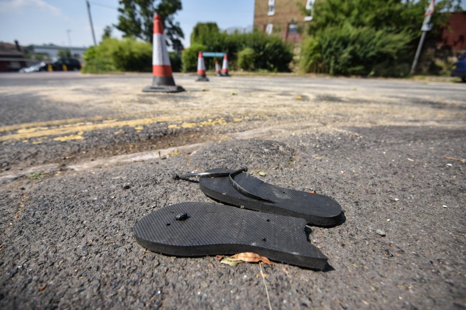 A pair of ruined flip flops are seen abandoned on Warwick Road in Bishops Stortford