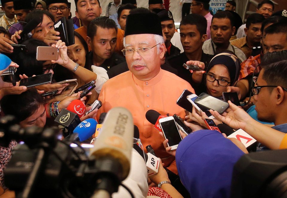 Malaysia's Prime Minister Najib Razak speaks to journalists after attending an event in Kuala Lumpur