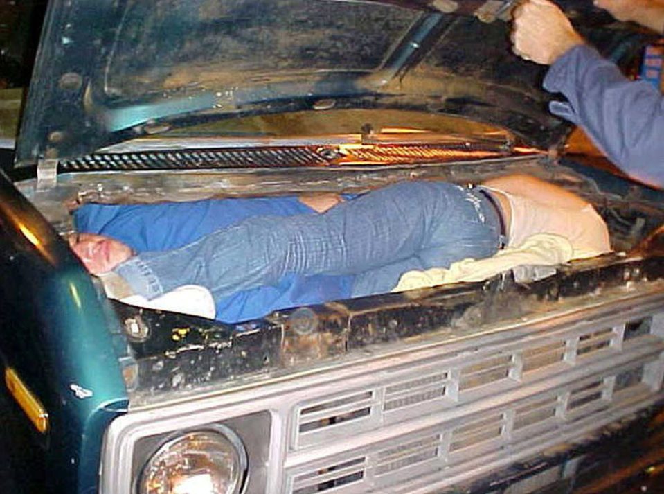 People stuffed themselves into the bonnet of cars but were caught by US Border Force despite their cunning attempt