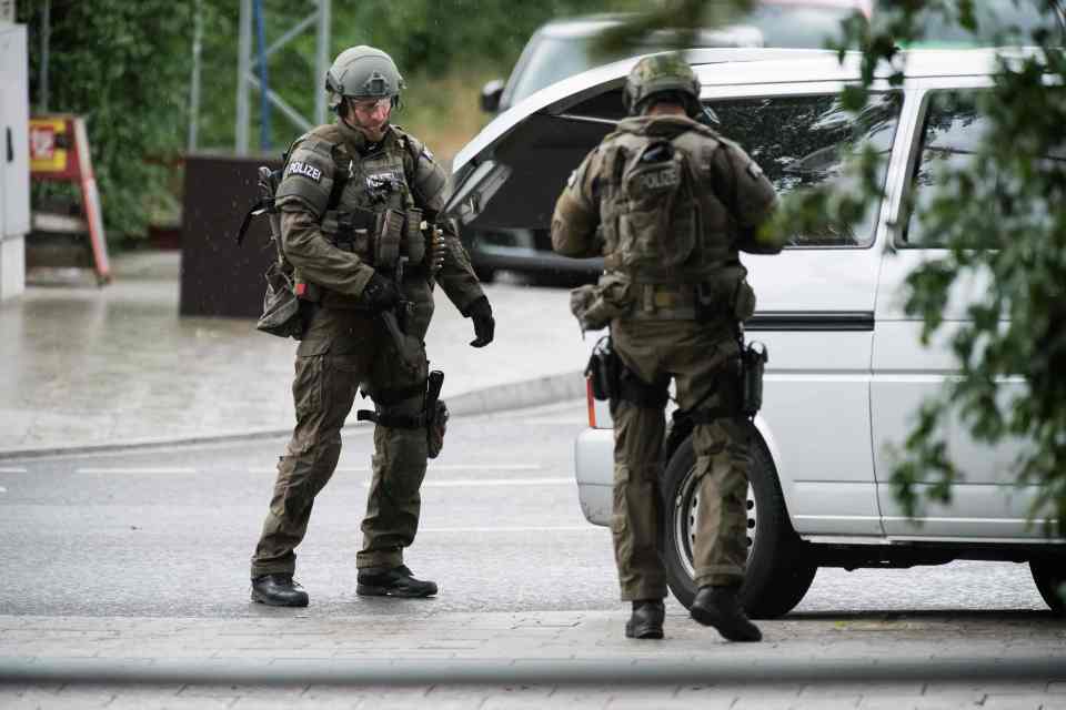 Cops secure the area following the attack on the shopping centre as reports emerge of other shootings