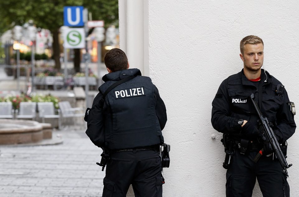 Cops armed with assault rifles are tonight patrolling the streets of Munich for three on-the-run gunmen