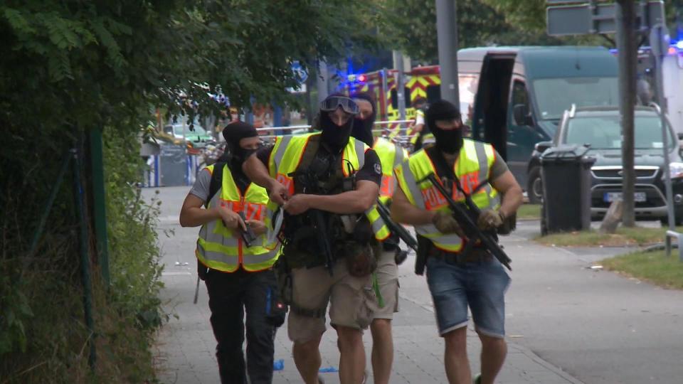Armed police in balaclava's are swarming the city on the hunt for the suspects