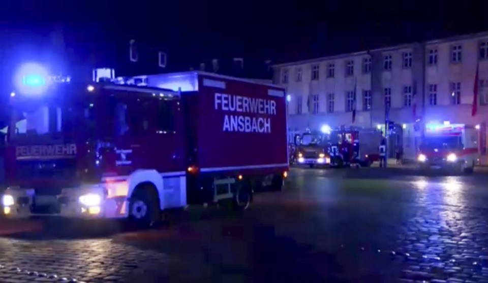 GERMANY OUT - In this image taken from video fire trucks and ambulances stand in the city center of Ansbach near Nuremberg, southern Germany, Monday morning, July 25, 2016, after a man was killed when an explosive device he was believed to be carrying went off near an open-air music festival, injuring 10 others. (News5 via AP)