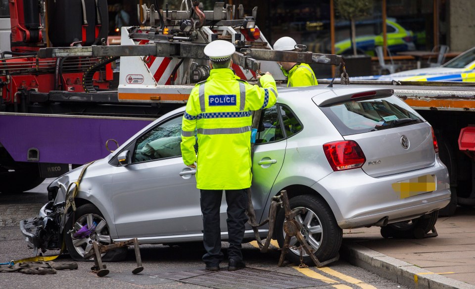 The Volkswagen Polo driven by Heslop is towed from the scene