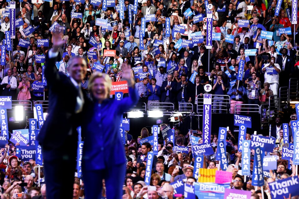 People cheer as Democratic presidential nominee Hillary Clinton joins U.S. President Obama onstage after his remarks on the third night of the Democratic National Convention in Philadelphia, Pennsylvania