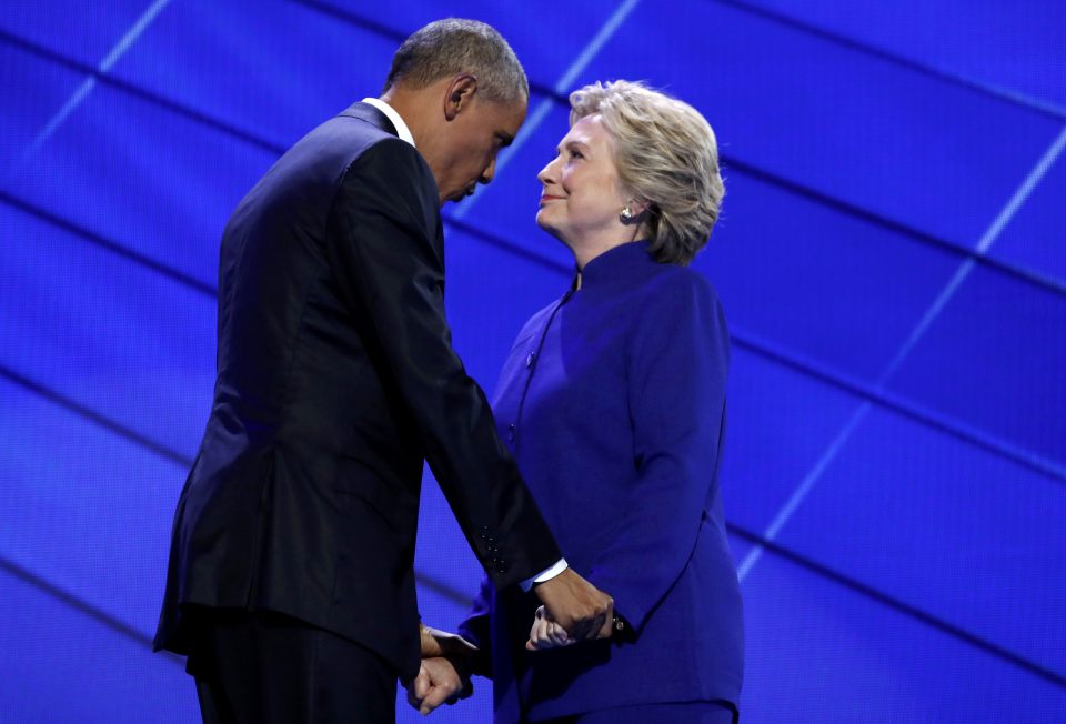 Democratic presidential nominee Hillary Clinton greets U.S. President Barack Obama as she arrives onstage at the end of his speech on the third night of the 2016 Democratic National Convention in Philadelphia, Pennsylvania
