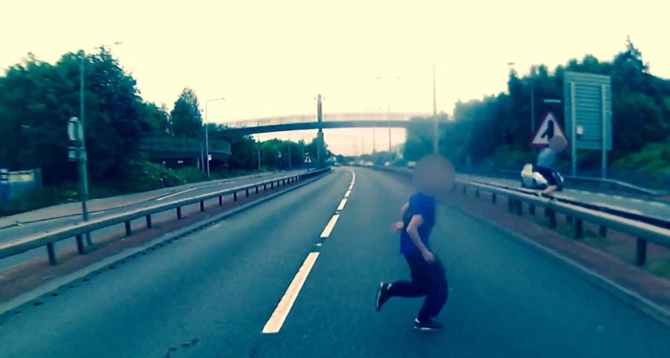 The helmet camera catches just how close he came to being struck by the biker