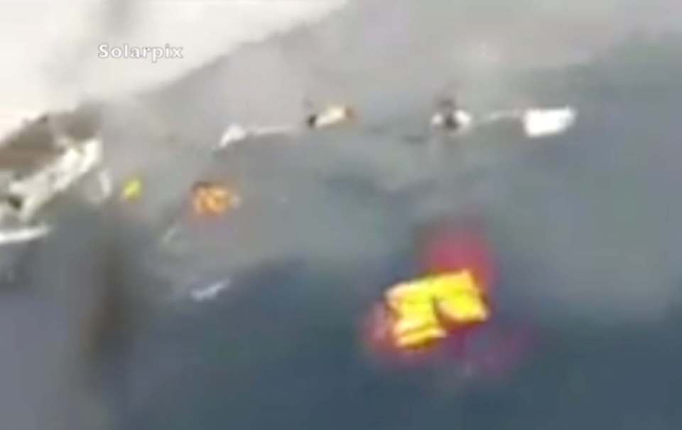The rescuers called "come, come" to encourage them to swim towards the safety of their boat