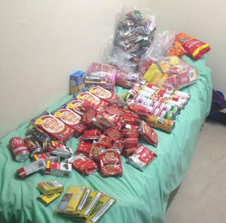 Another pic shows Usher’s bed covered in rolling tobacco and snacks 