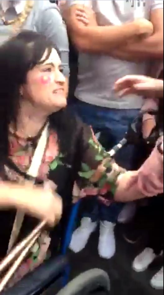 The disabled mum-of-one refuses to move when staff tell her she has to leave the area
