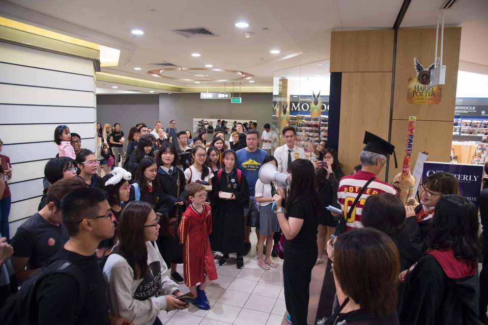 Fans wait outside a book store to open i