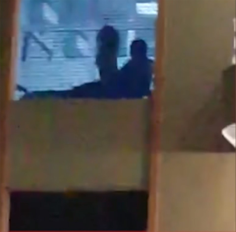 The amorous duo were caught having a little alone time in an office