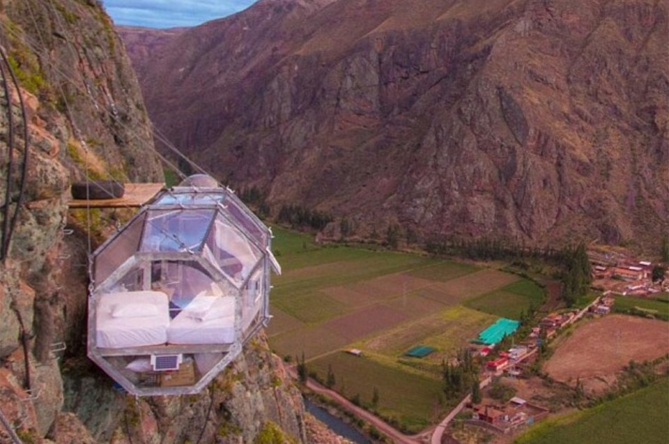 Daredevils can spend the night in a glass pod perched on the side of a steep cliff, assuming they can climb up to it