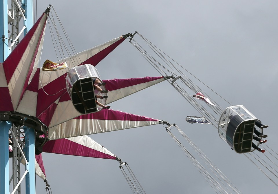Visitors ride on the Star Flyer carousel fairground attraction on the Southbank in central London