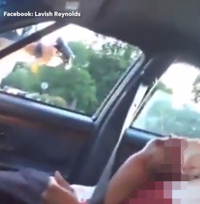 The woman in the video, who says she is the girlfriend of they dying man, says the pair had been pulled over for a broken tail light