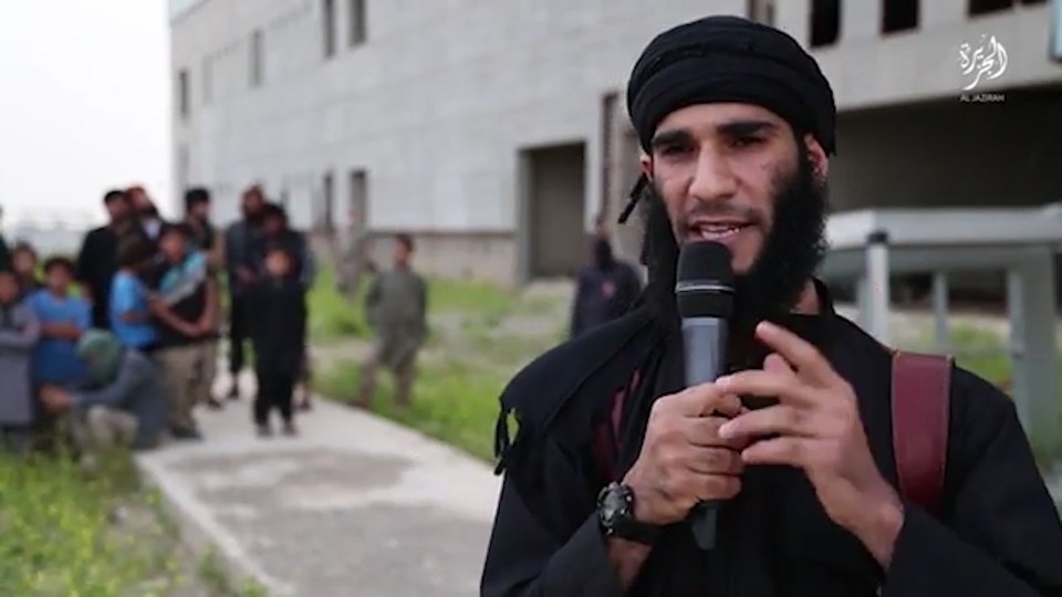An ISIS member preaches to the camera and labels the man "guilty"