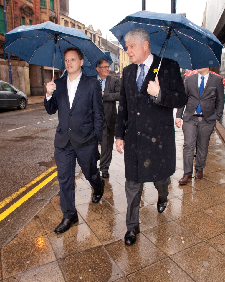 Grant Shapps, the Chairman of the Conservative Party during a whistle-stop tour of Swansea in South Wales March 6th, 2014 pictured left with Byron Davies, 