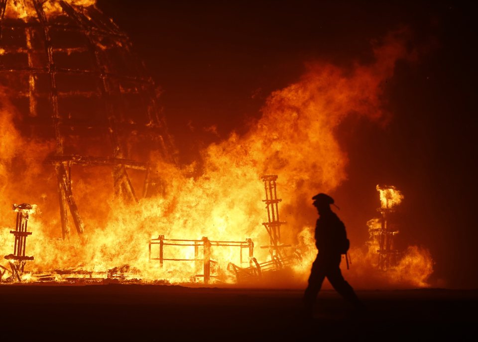 Burning down the house ... Remnants of Burning Man sculpture signify the end of mad festival