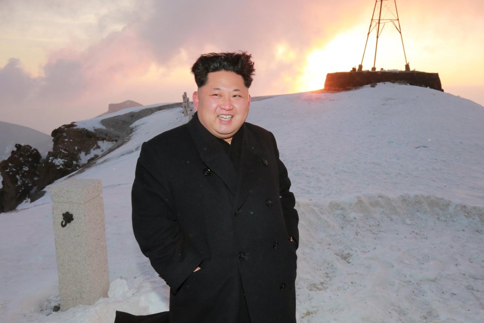 North Korean leader Kim Jong Un views the dawn from the summit of Mt Paektu in 2015