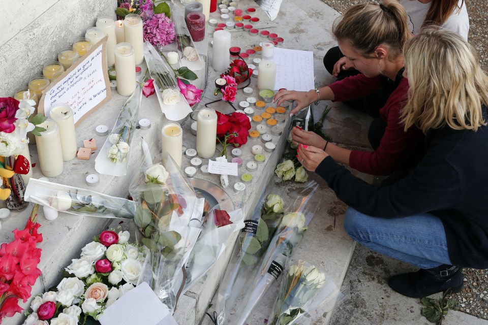 Flowers, candles and messages are placed on the city hall entrance closed to the home of Father Jacques Hamel after he was killed