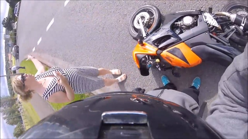 Other motorists get out of their cars to separate the two men