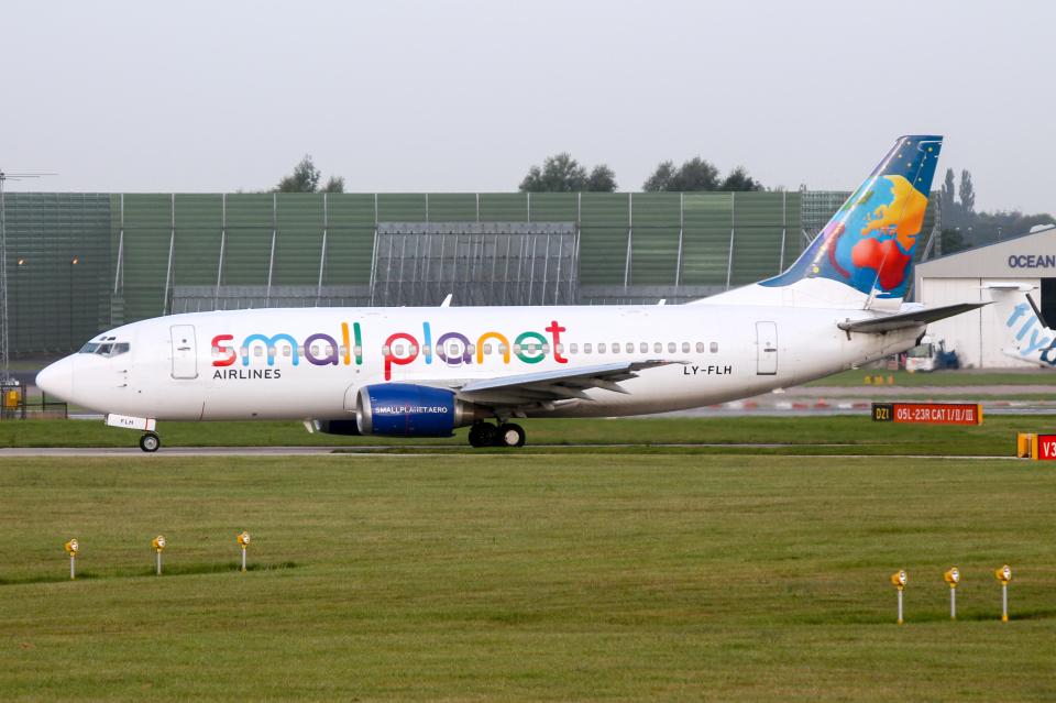 Small Planet Boeing 737-300 taxis to runway 23L at Manchester airport.