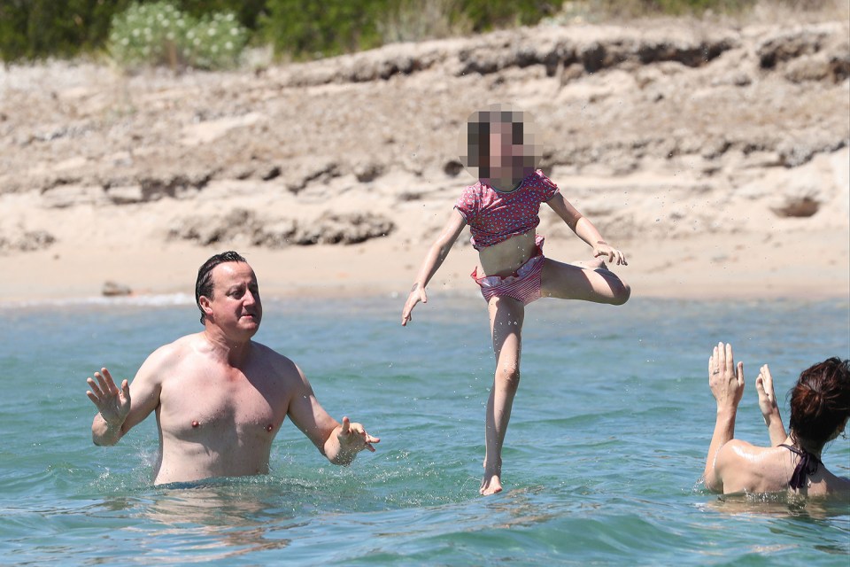 Jump . . . kids play in the sea with Cameron