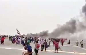 Incredible footage shows 300 passengers including 24 Brits fleeing burning Emirates jet