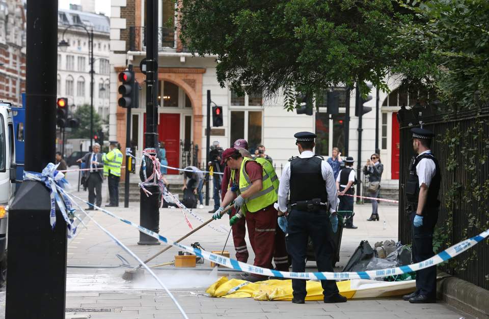 The street of the brutal stabbing was being cleaned this morning